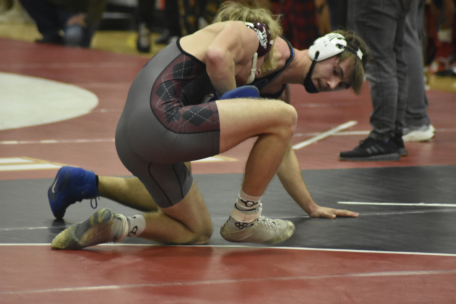 East Hampton's Adam Beckwith tries to keep his opponent in the circle.    DREW BUDD