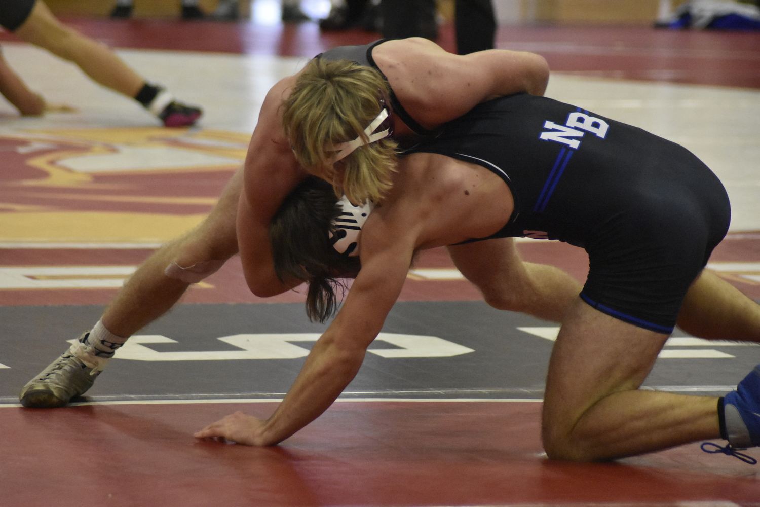 East Hampton's Adam Beckwith works on getting a pin.   DREW BUDD