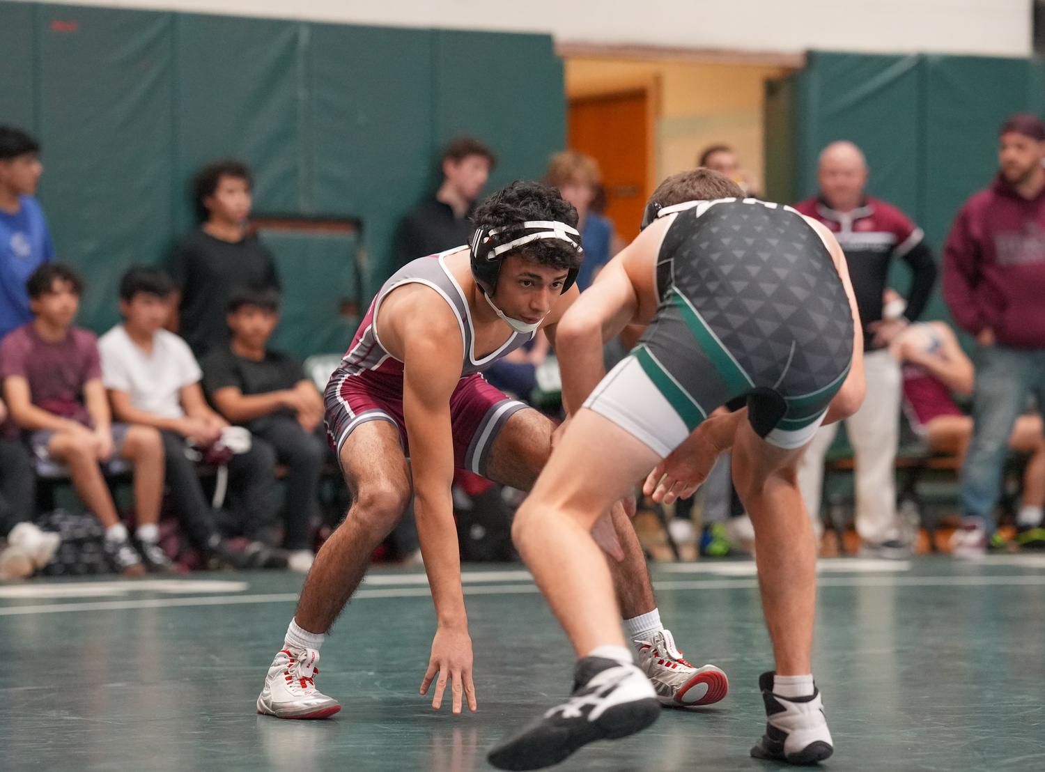 East Hampton's Josue Elias battles with Tadgh Green.   RON ESPOSITO