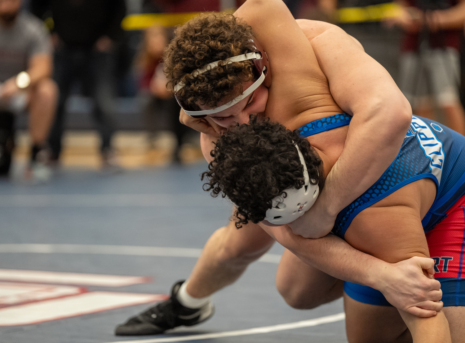 East Hampton's Franco Palombino wrestles down Bellport's Justin Calero to the mat in their quarterfinals match.   RON ESPOSITO