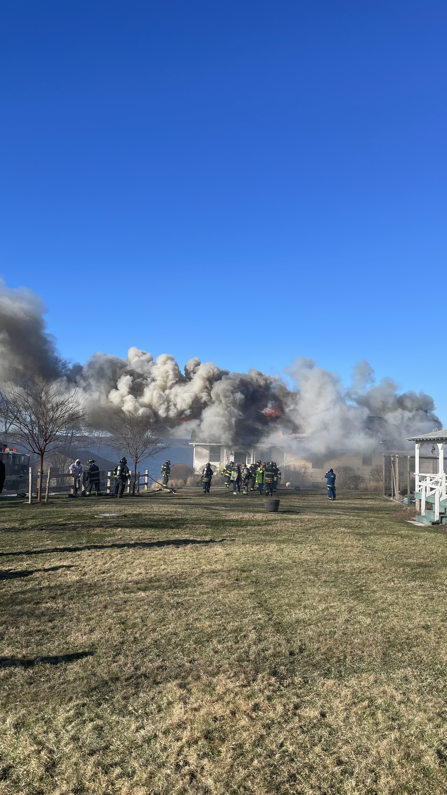 Montauk Fire Department firefighters battled a fire that badly damaged a waterfront cottage on East Lake Drive on Monday morning. Nobody was home when the fire broke out. DOUG KUNTZ