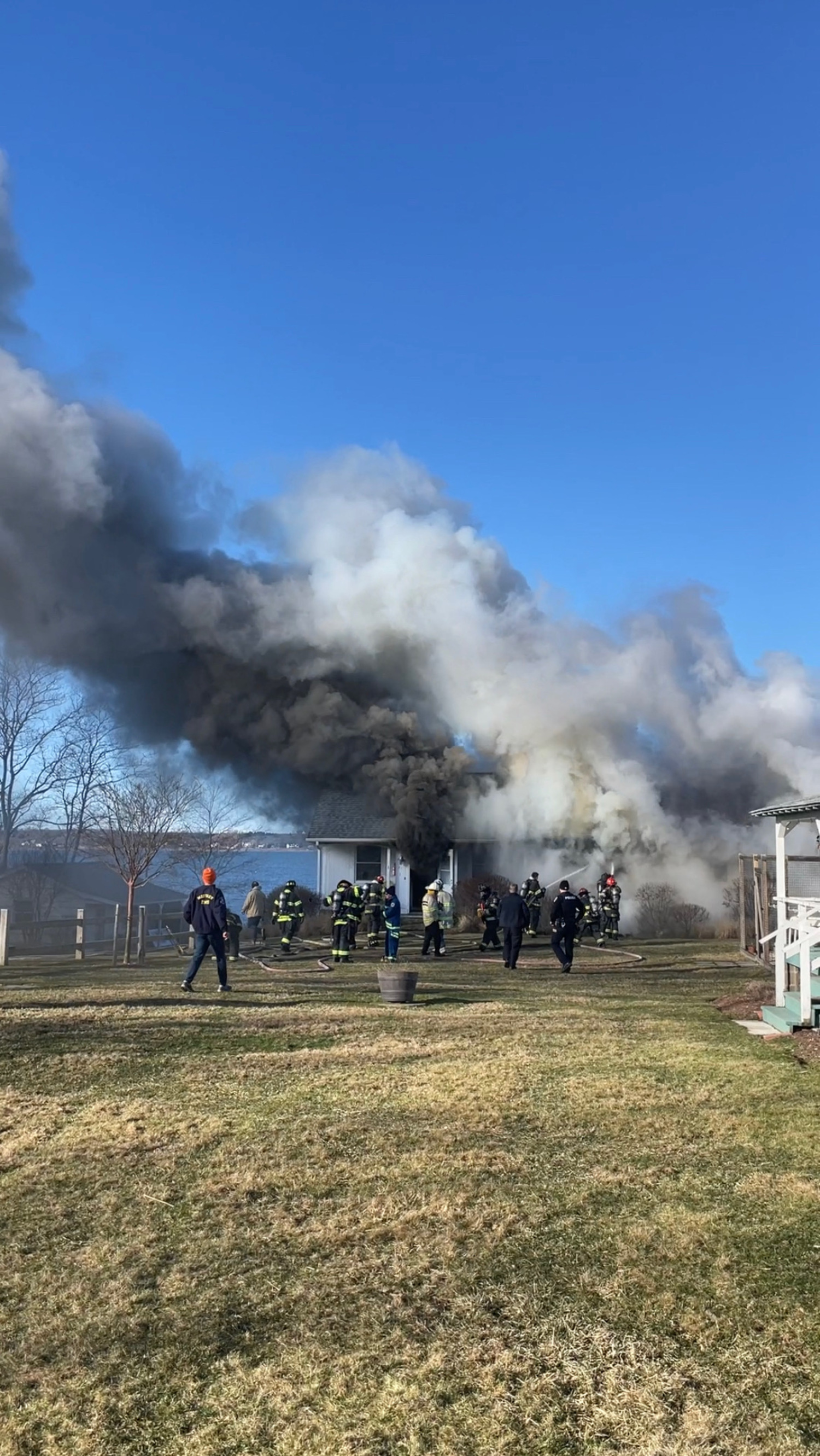 Montauk Fire Department firefighters battled a fire that badly damaged a waterfront cottage on East Lake Drive on Monday morning. Nobody was home when the fire broke out. DOUG KUNTZ