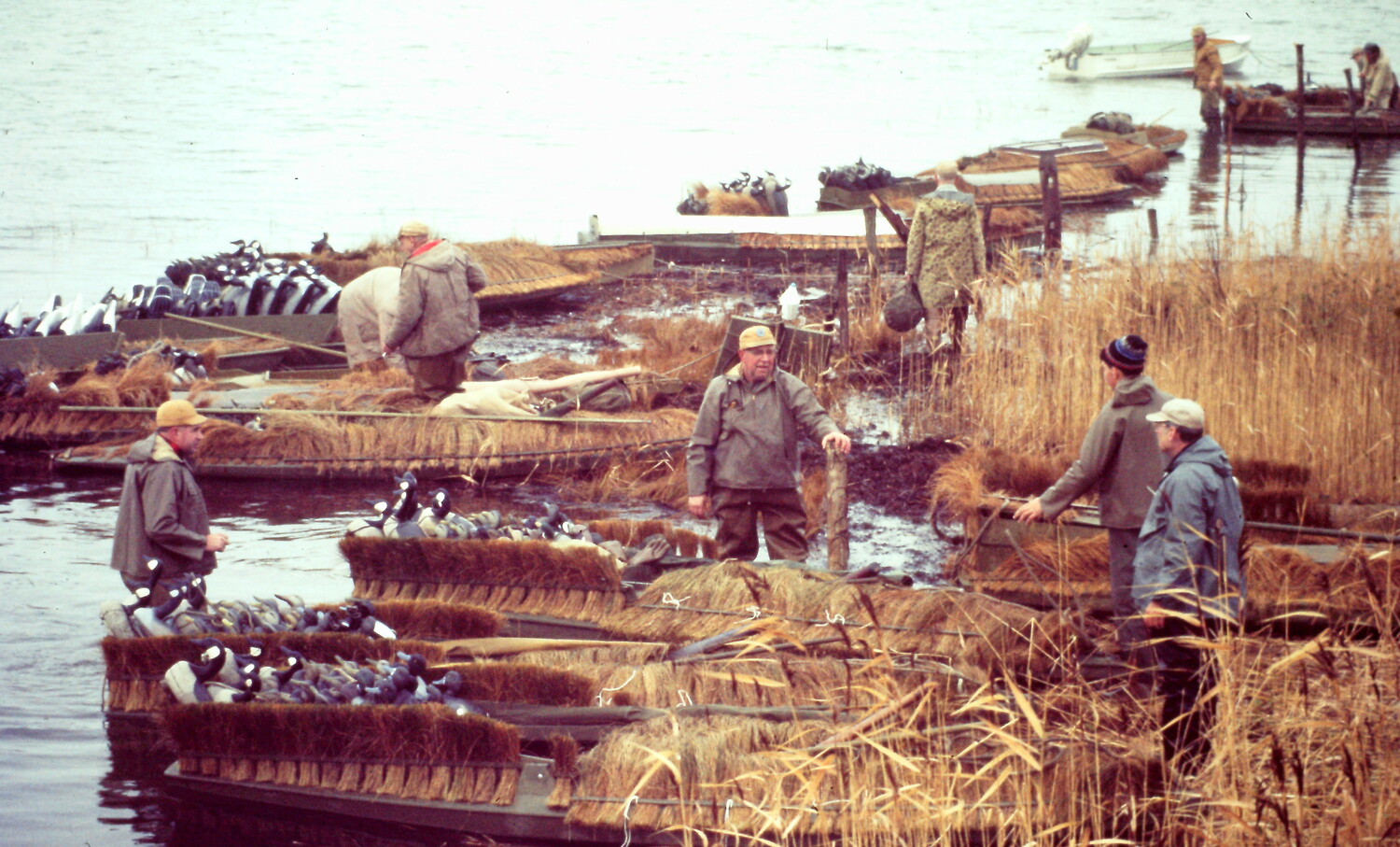 Members of the Pattersquash Gunners Association, which celebrates its 100th anniversary this year, gathering before a morning shoot in the mid-20th century. The Bellport Bay club and the bountiful store of antique hunting gear its members have will be the spotlight subject of the 52nd Long Island Decoy Collector Association Show on March 2 in Hauppauge.