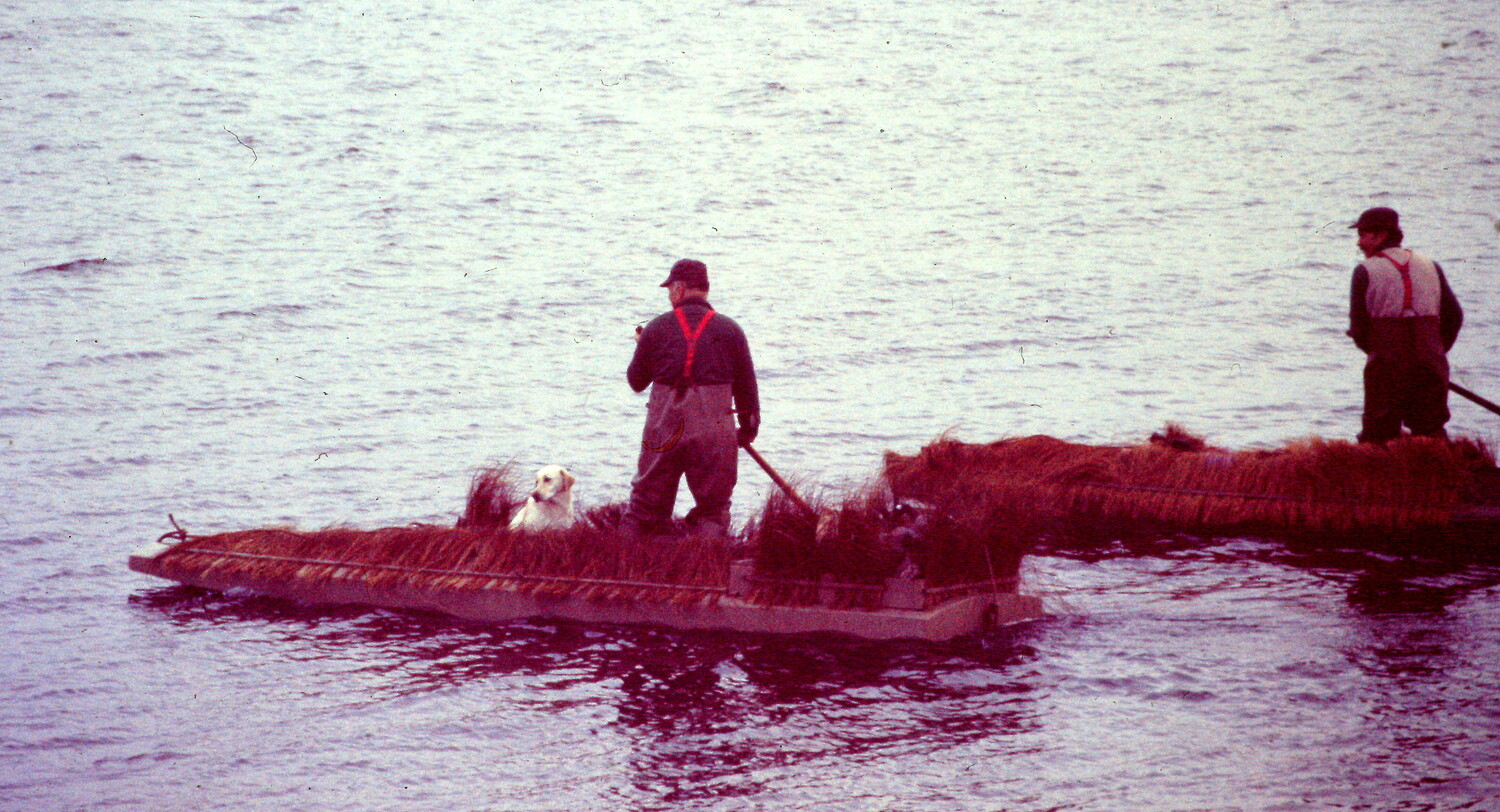 Polling scooter rigs through the shallows of Bellport Bay.