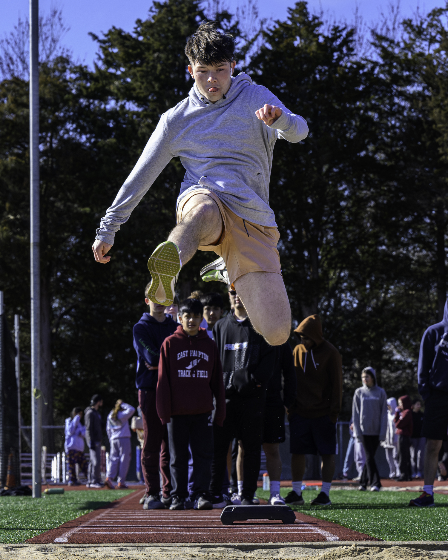 Aidan Schmitz lifts off in the long jump.  MARIANNE BARNETT