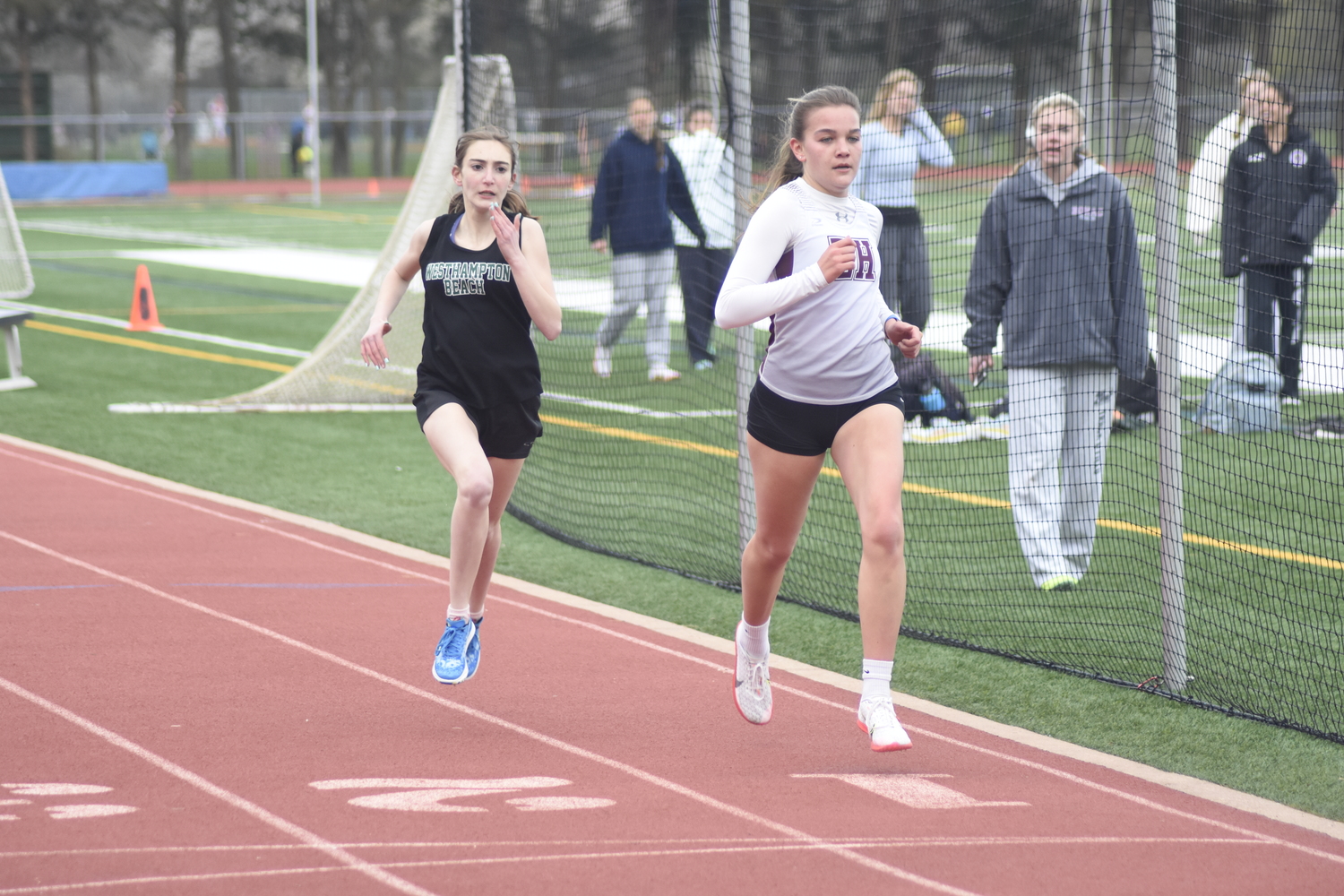 Greylynn Guyer beats out a Westhampton Beach runner in the 800-meter run.   DREW BUDD