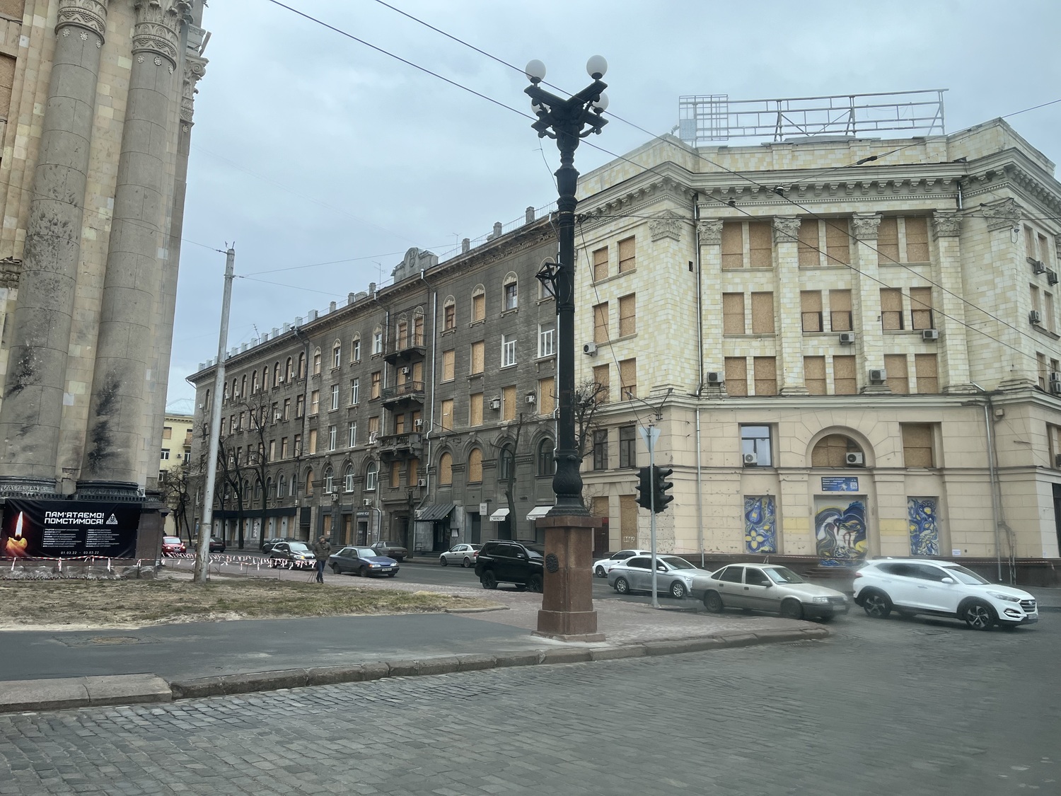 Boarded up windows in a bomb-damaged building in Ukraine. COURTESY JOHN REILLY