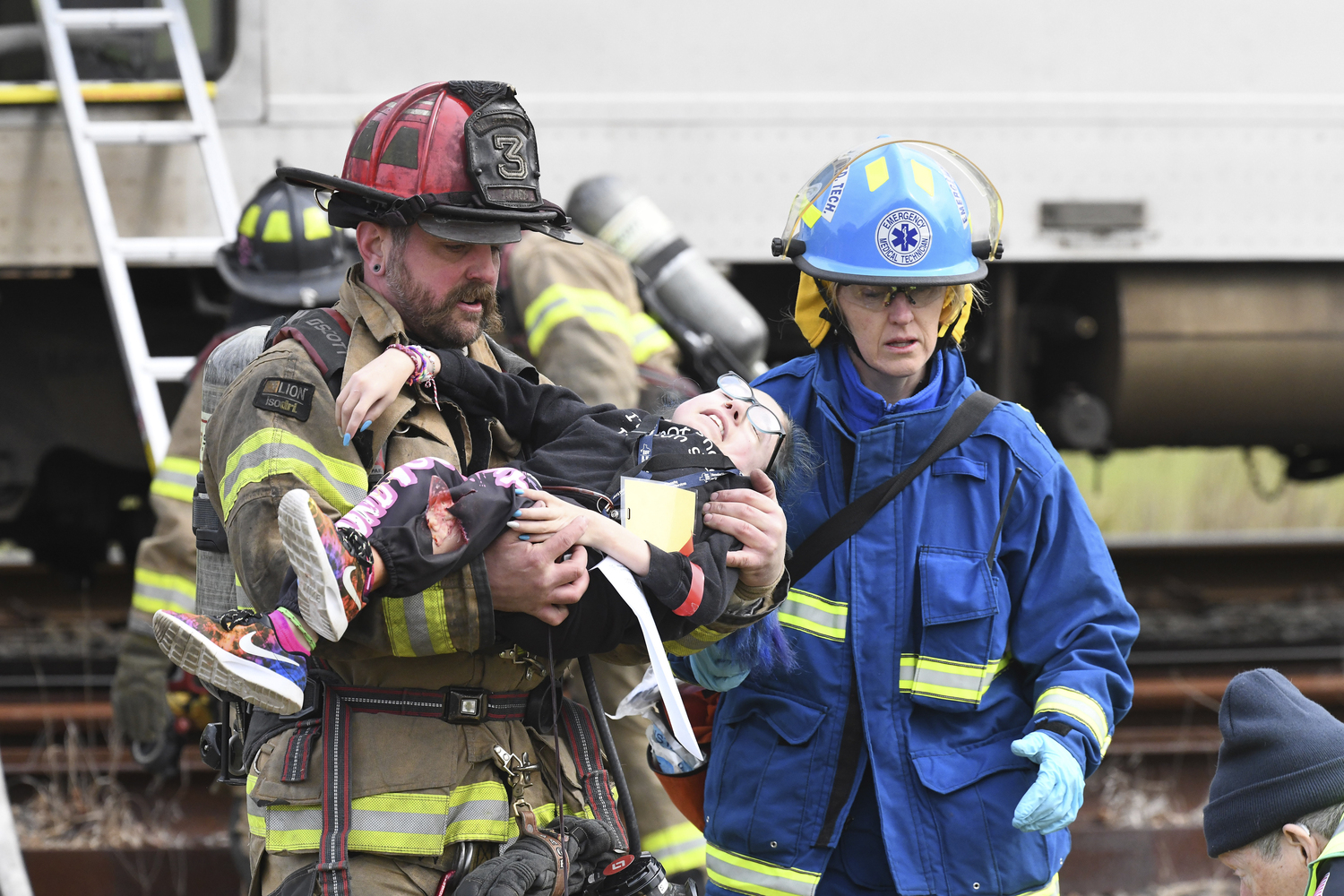 First responders go to work during the full-scale mass casualty drill involving a train accident on Sunday morning in Amagansett.  DOUG KUNTZ