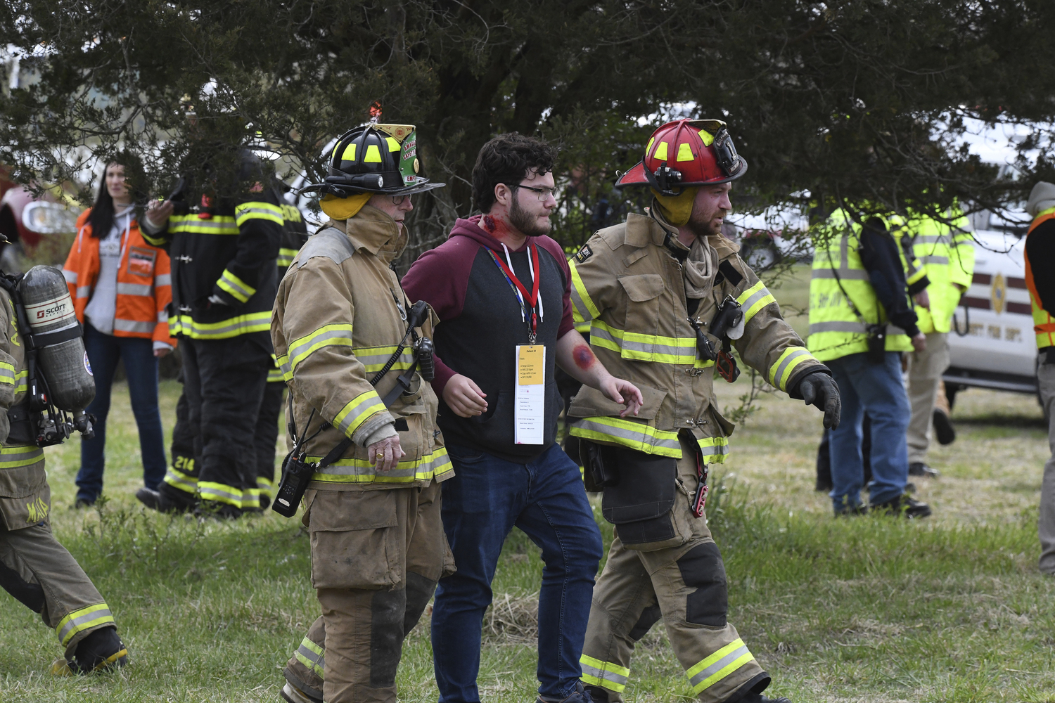 First responders go to work during the full-scale mass casualty drill involving a train accident on Sunday morning in Amagansett.  DOUG KUNTZ