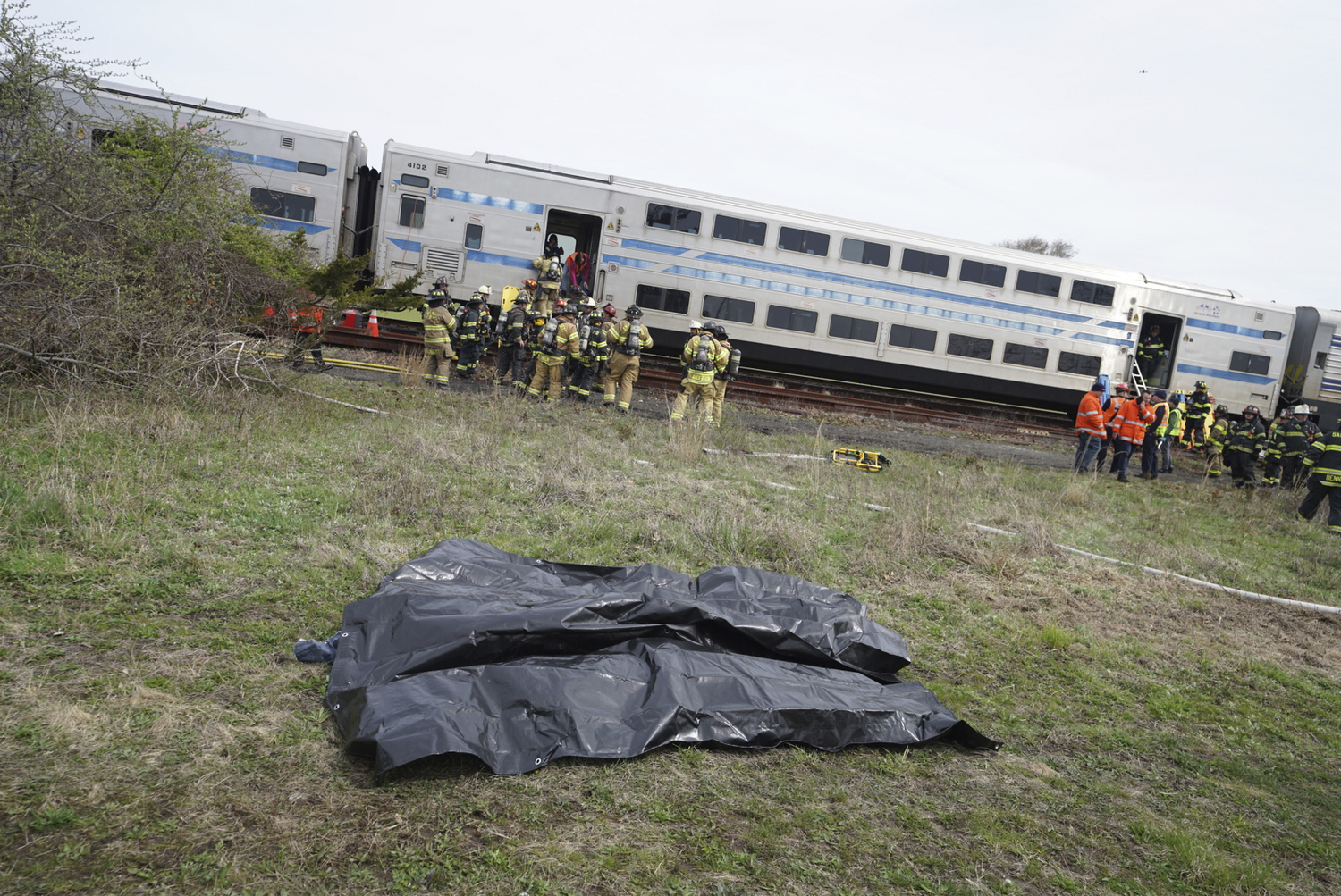 First responders go to work during the full-scale mass casualty drill involving a train accident on Sunday morning in Amagansett.  DOUG KUNTZ