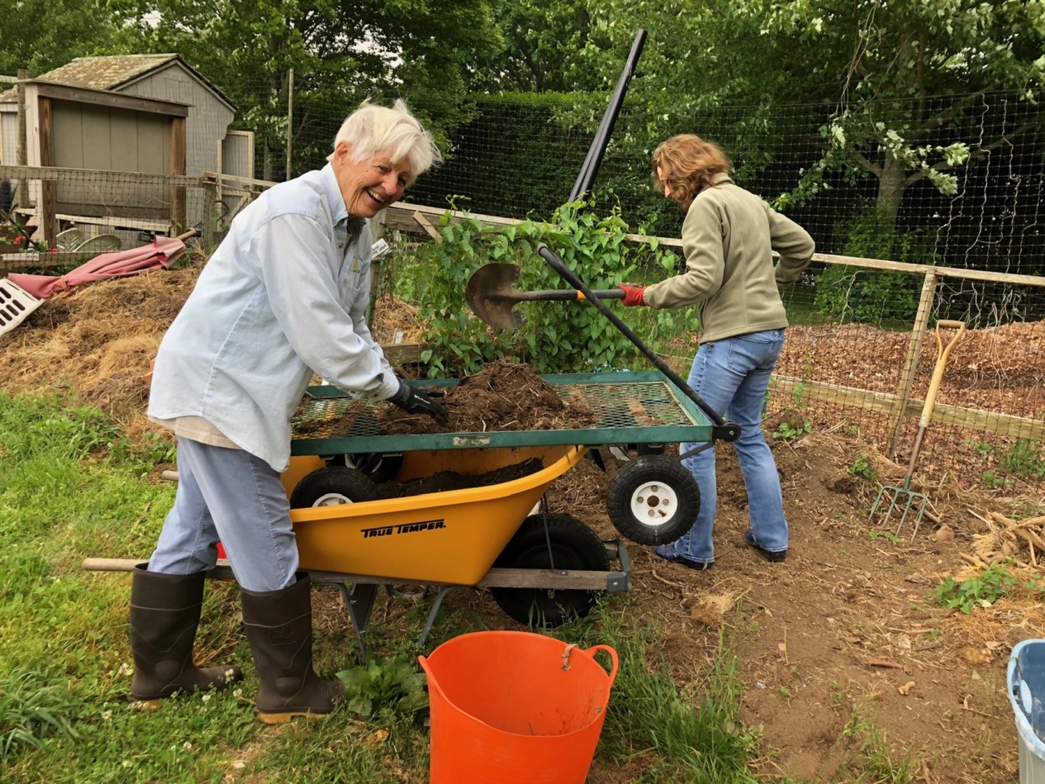 Gardeners sifting compost. Aside from getting a serious cardiovascular workout, working with the soil has been proven to strengthen your immune system. COURTESY GOOD SHEPHERD FARM