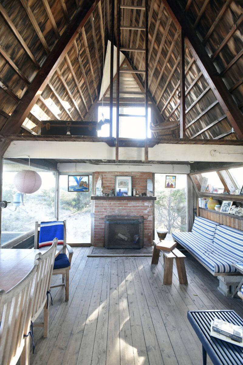 The living area with a view of the loft, which is accessible by drop-down ladders.    DANA SHAW