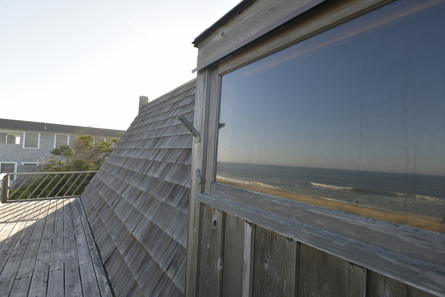 Windows on the top deck reflect the ocean.  DANA SHAW