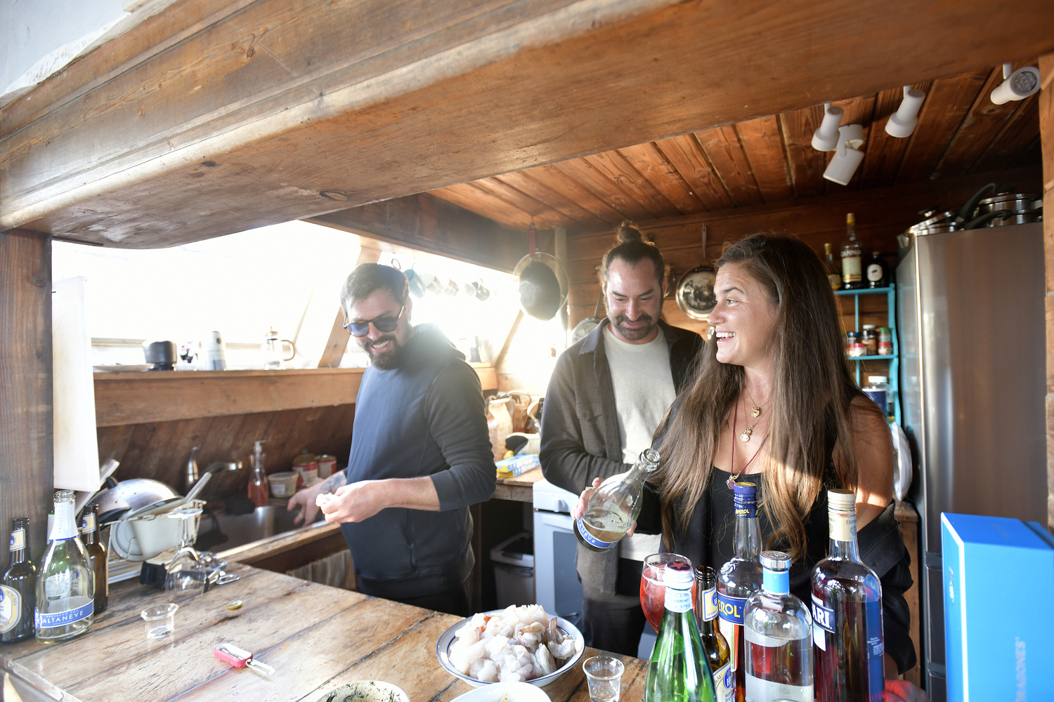 Orson Frisbie and Monica and Matt Frisbie in the kitchen.  DANA SHAW