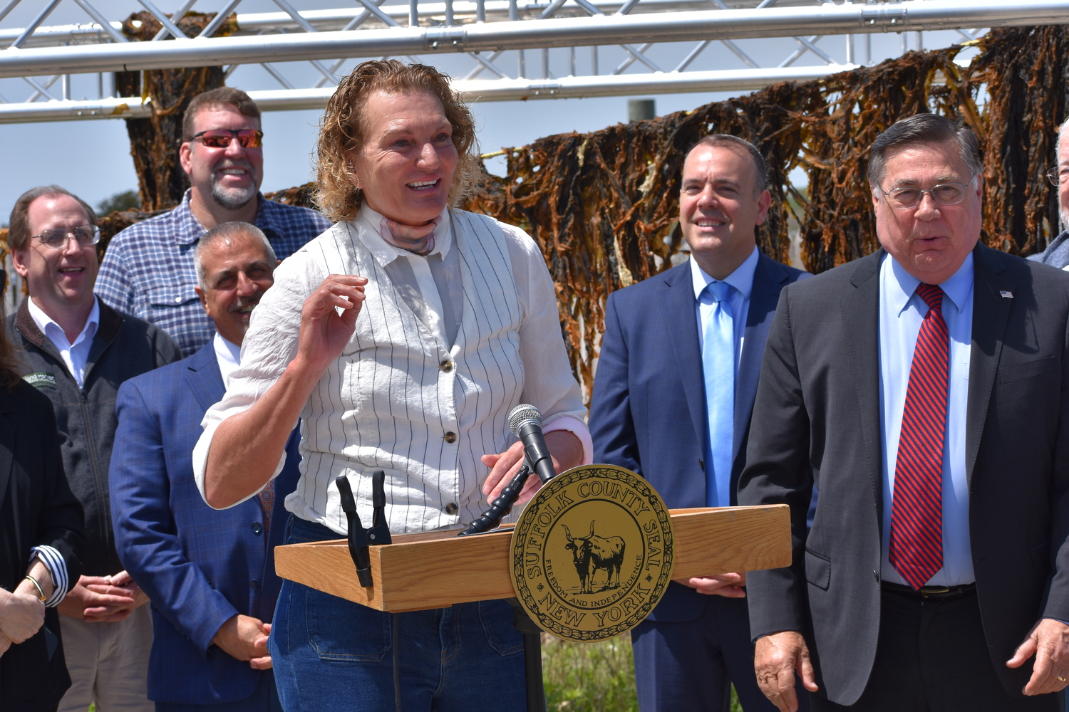 Former pro basketball player turned oyster and kelp farmer Sue Wicks of Violet Cove Oyster Co. on Tuesday in Mastic Beach, celebrating the first permitted commercial kelp harvest in New York State.  BRENDAN J. O'REILLY