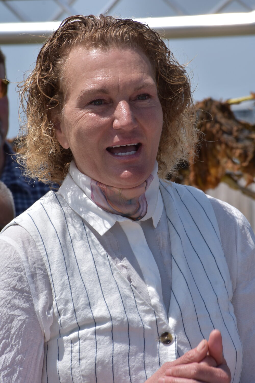 Former pro basketball player turned oyster and kelp farmer Sue Wicks of Violet Cove Oyster Co. on Tuesday in Mastic Beach, celebrating the first permitted commercial kelp harvest in New York State.  BRENDAN J. O'REILLY