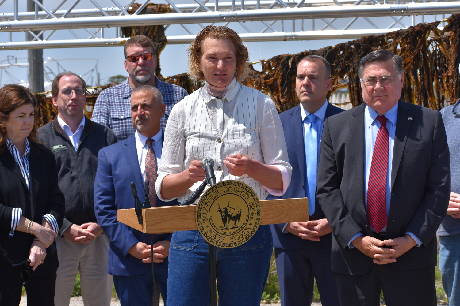 Former pro basketball player turned oyster and kelp farmer Sue Wicks of Violet Cove Oyster Co. on Tuesday in Mastic Beach, celebrating the first permitted commercial kelp harvest in New York State.  BRENDAN J. O'REILLY