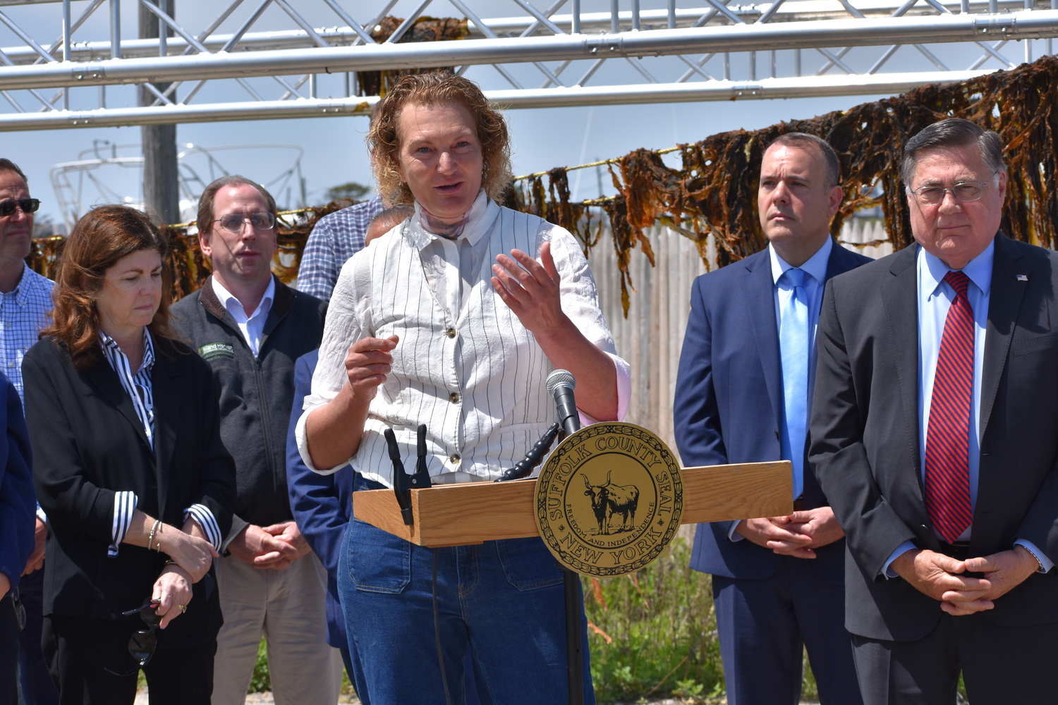 Former pro basketball player turned oyster and kelp farmer Sue Wicks of Violet Cove Oyster Co. on Tuesday in Mastic Beach, celebrating the first permitted commercial kelp harvest in New York State.  BRENDAN J. O'REILLY