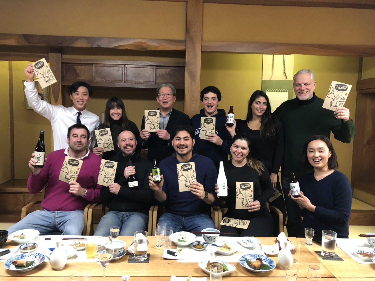 Jesse Matsuoka, seated, center, and winemaker Roman Roth, standing, far right, during their 2019 visit to Hakkaisan Brewery in Niigata, Japan. COURTESY JESSE MATSUOKA