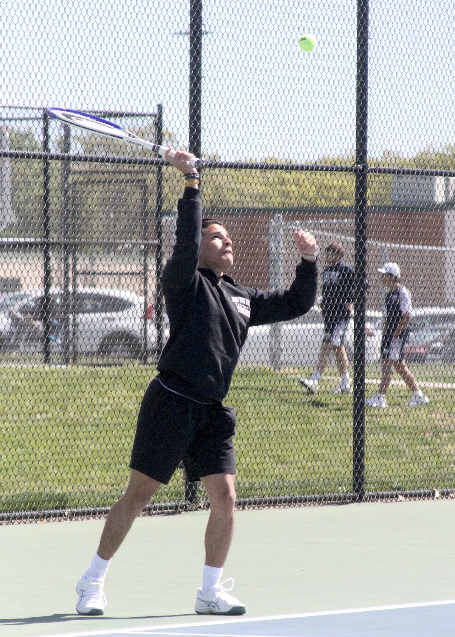 Hampton Bays junior Kevin David Saa Pacheco serves. DESIRÉE KEEGAN