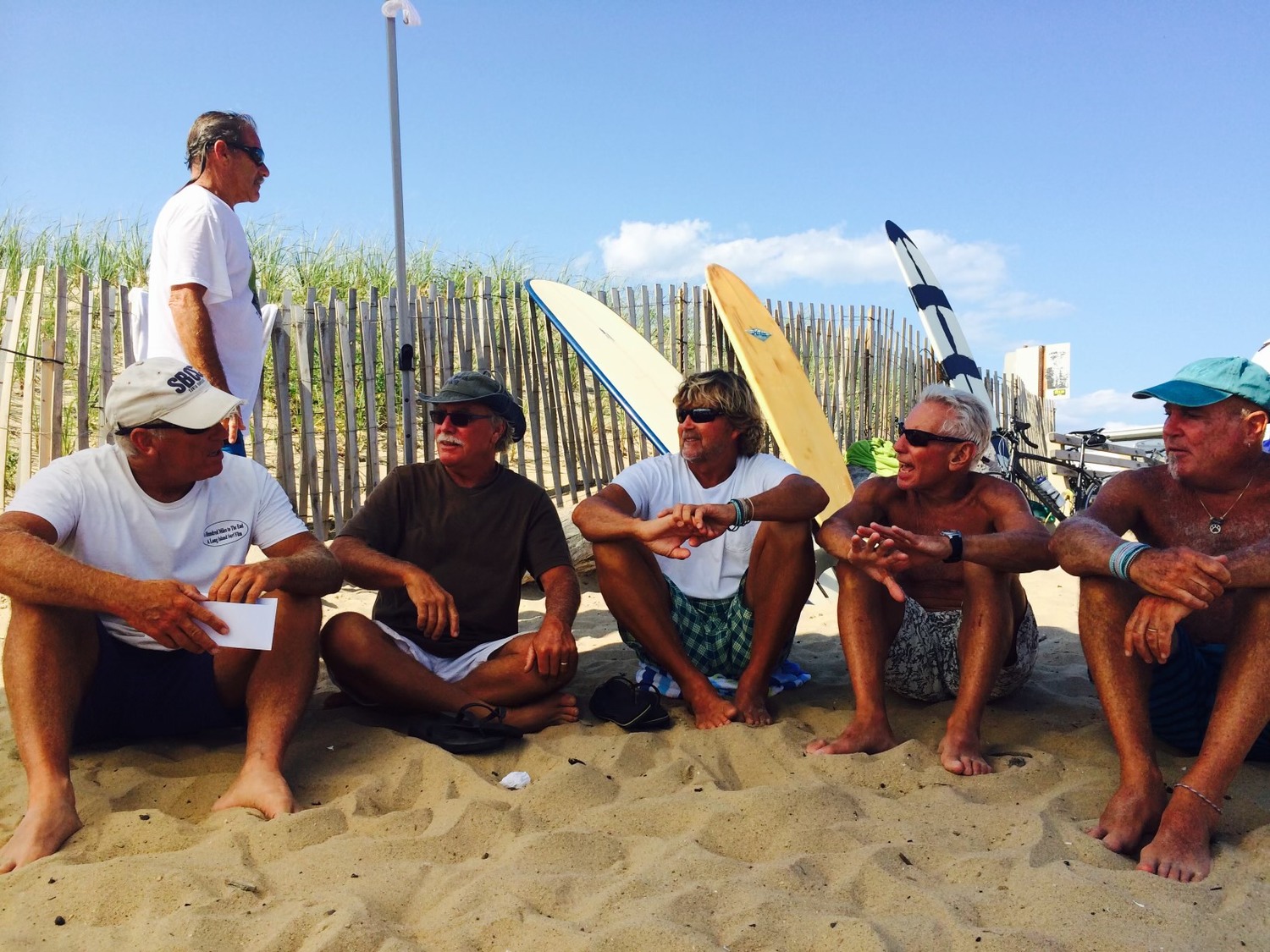 Socializing at Ditch Plains Beach, from left, Tom Staubister, Rusty Drumm, Glenn Krug, Dave Nelson and Fred Gold. COURTESY DAVE NELSON