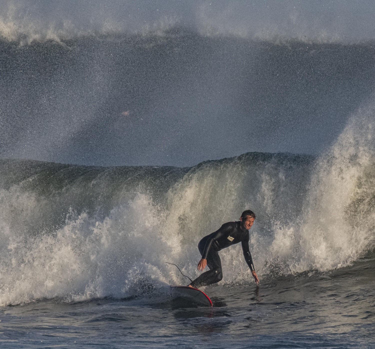 Joel Tudor, considered a legend of the longboard scene, catches a wave at Ditch Plains Beach. DOUG KUNTZ