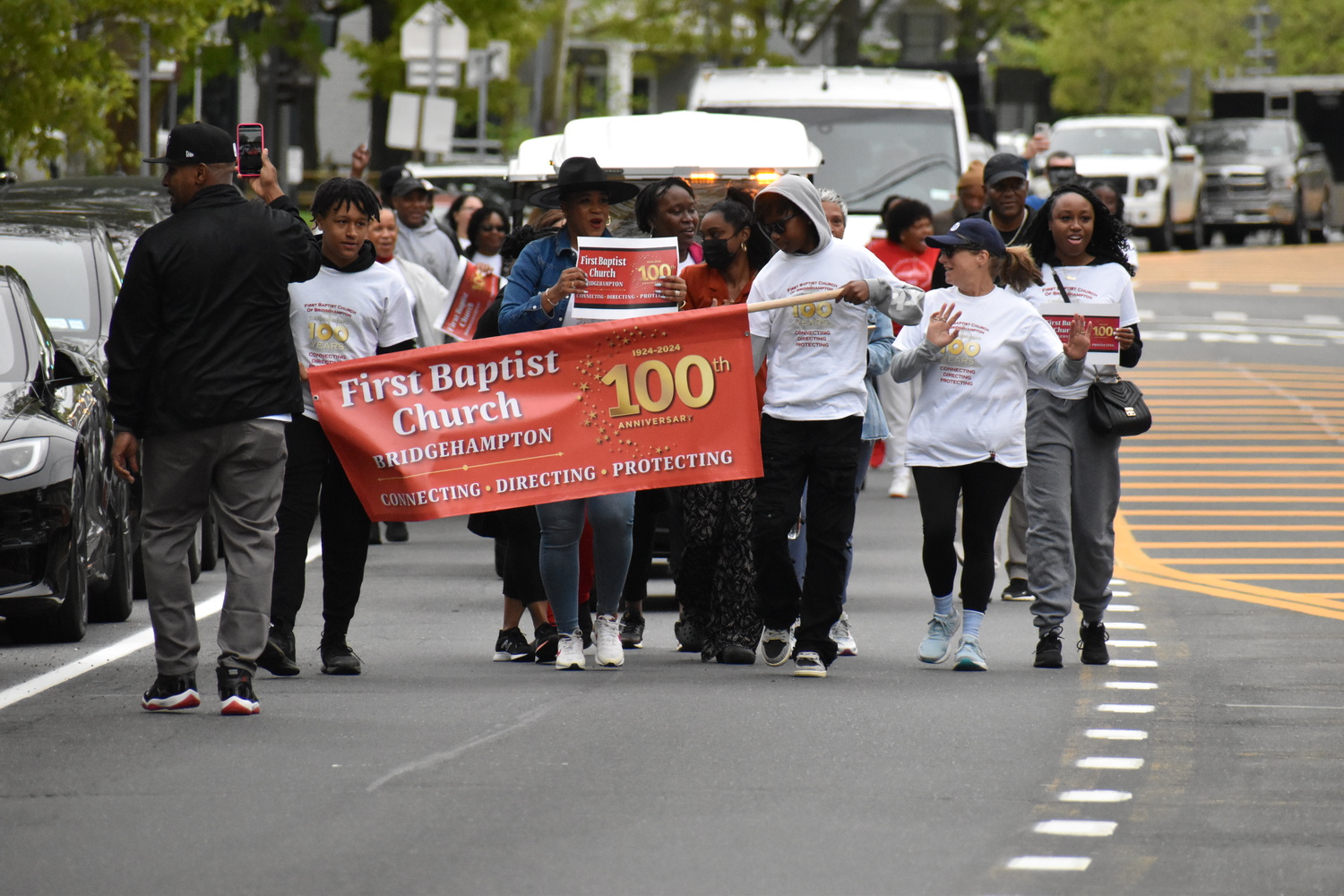 Members of the First Baptist Church of Bridgehampton marched on Montauk Highway on Sunday from their original home on Corwith Avenue to their current church on the Bridghampton-Sag Harbor Turnpike to celebrate the congregation's centennial. STEPHEN J. KOTZ