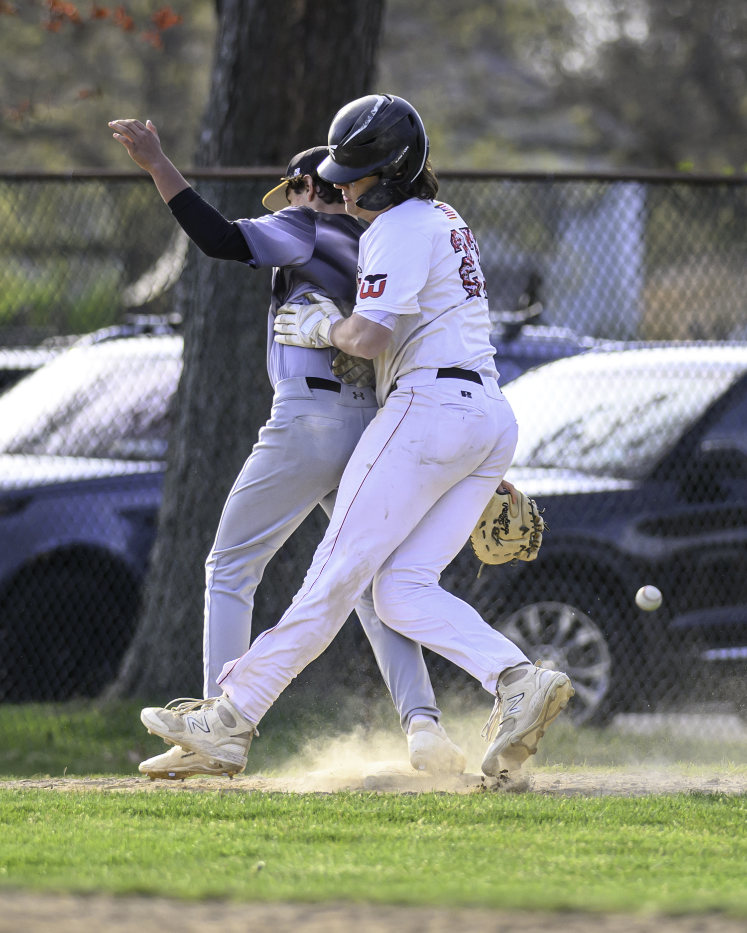 Bridgehampton first baseman Elliot McGonegal and Pierson's Charles Schaefer collide at first base.  MARIANNE BARNETT