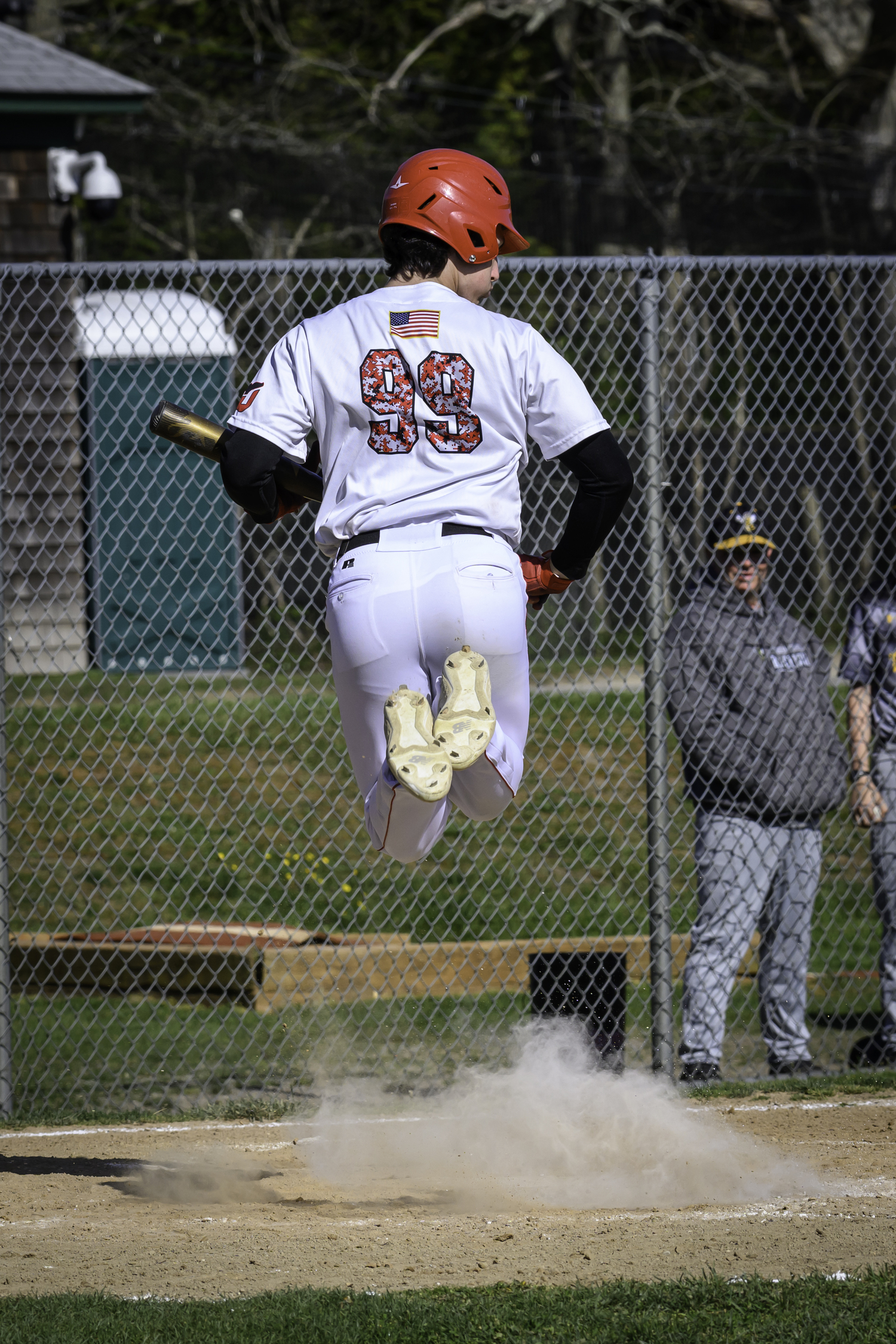 Pierson junior Lucas Iulo leaps out of the way of a wild pitch.  MARIANNE BARNETT