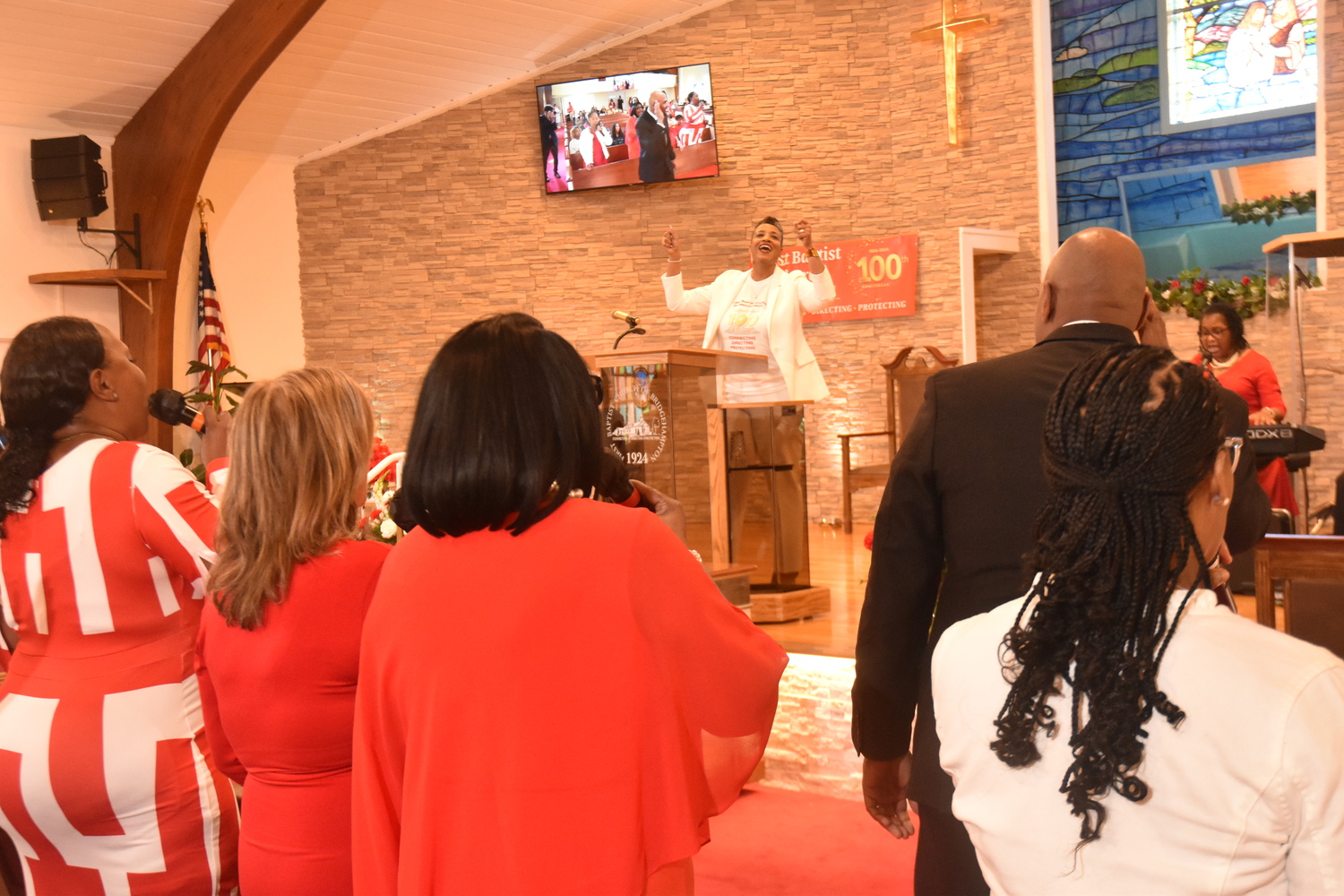 The Reverend Tisha Williams preaching at the First Baptist Church of Bridgehampton's centennial observance on Sunday. STEPHEN J. KOTZ