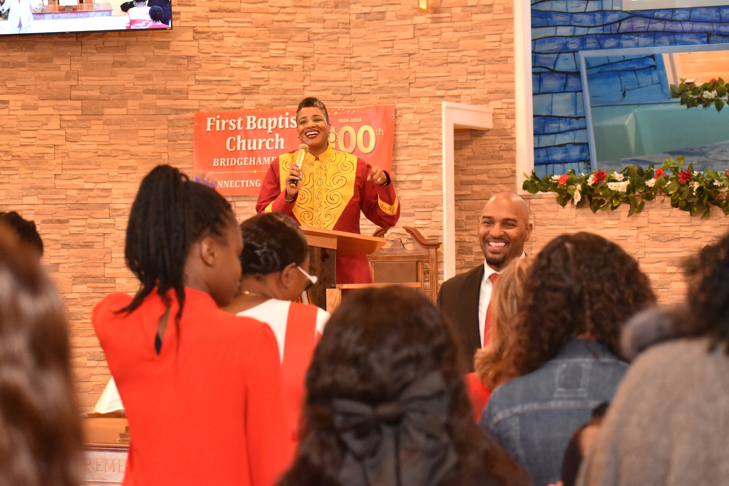 The Reverend Tisha Williams, with her husband, Larry Williams, during Sunday's service. STEPHEN J. KOTZ