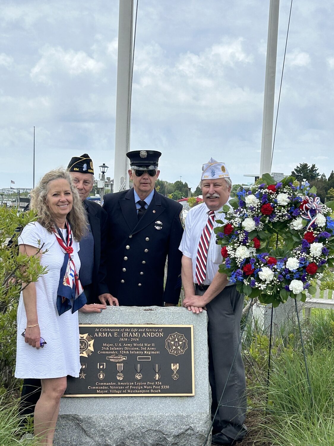 Members of American Legion Post 834 placed a wreath at the  Ham Andon Memorial at the Westhampton Beach Village Marina for Memorial Day. From left, Ham Andon's granddaughter and Town of Southampton Clerk Sundy Schermeyer, Tom Hadlock, Fred Bauer and Mike Pankowski.  COURTESY TOM HADLOCK