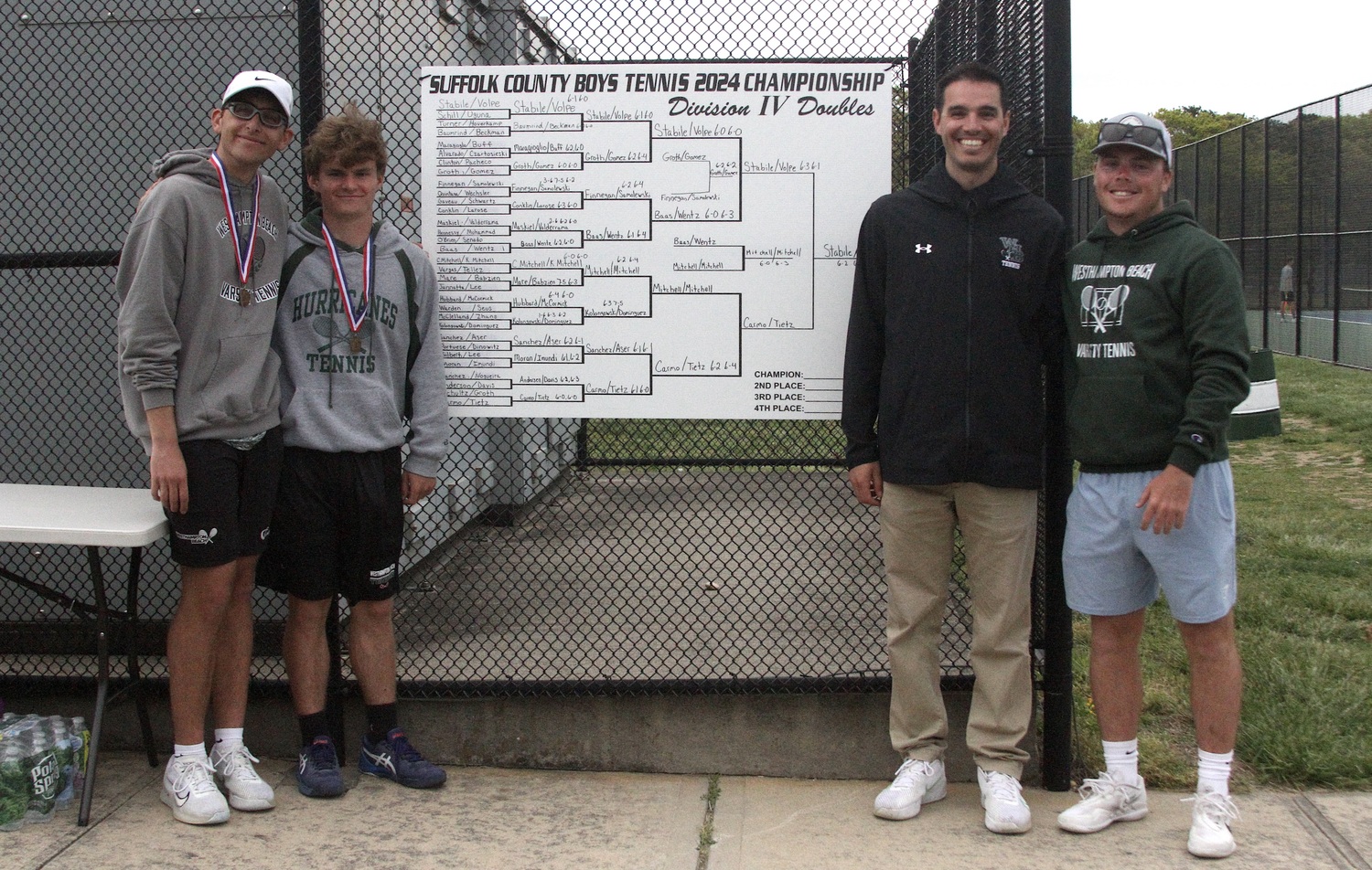 Junior Giancarlo Volpe, senior Bobby Stabile, head coach Matt Reed and assistant coach Riley Smith. DESIRÉE KEEGAN