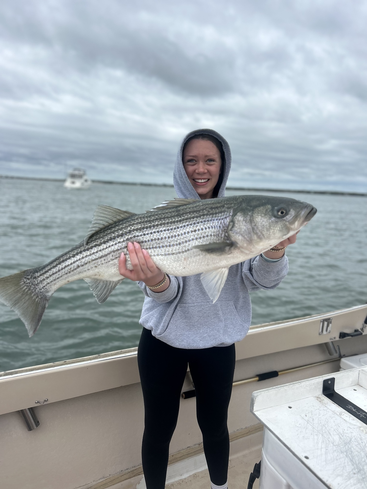 Charleigh Ries caught this beautiful Shinnecock Bay striped bass while fishing with her dad, Capt. Brad Ries, last month. SOMEDAY CAME CHARTERS