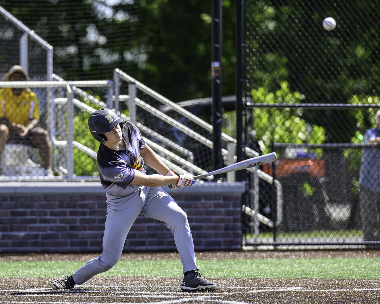 Ross senior Milo Tompkins connects with a pitch. MARIANNE BARNETT