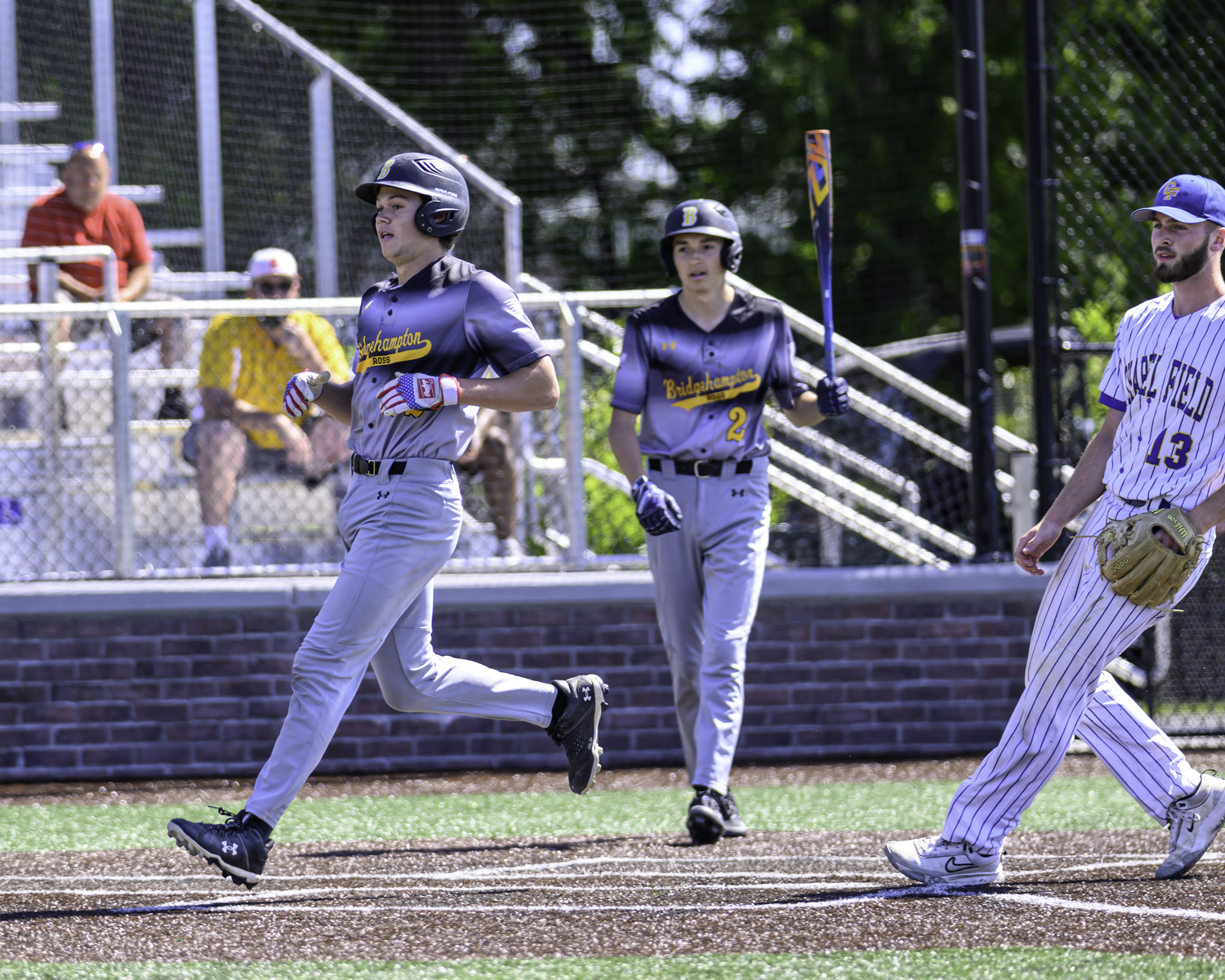 Ross senior Milo Tompkins crosses home plate. MARIANNE BARNETT