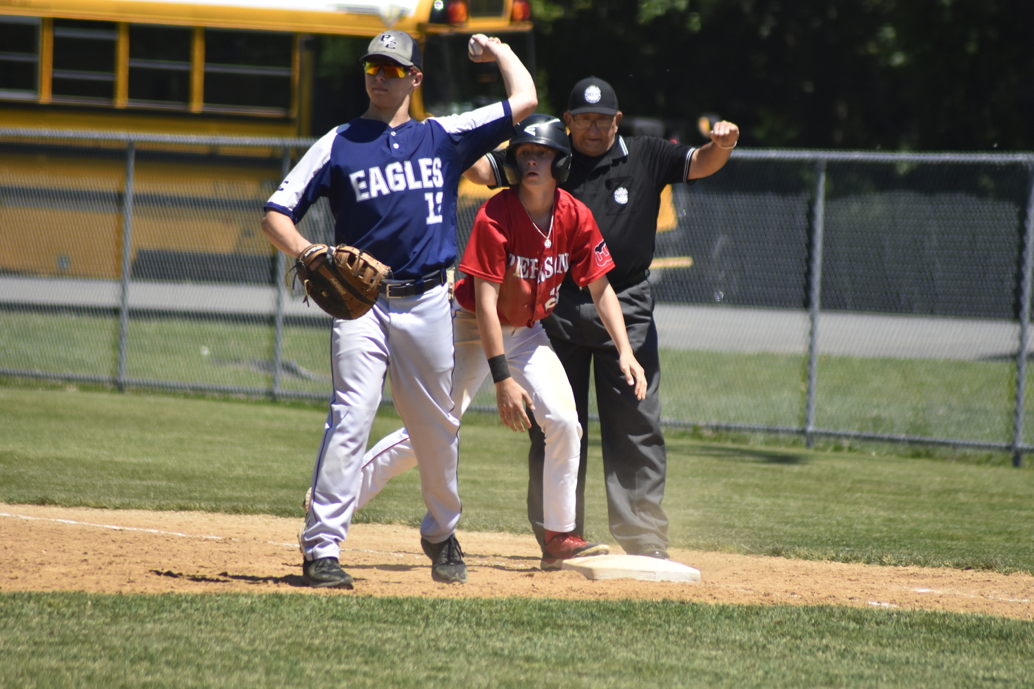 Whaler Brian Schroeder dives back to first base safely.   DREW BUDD