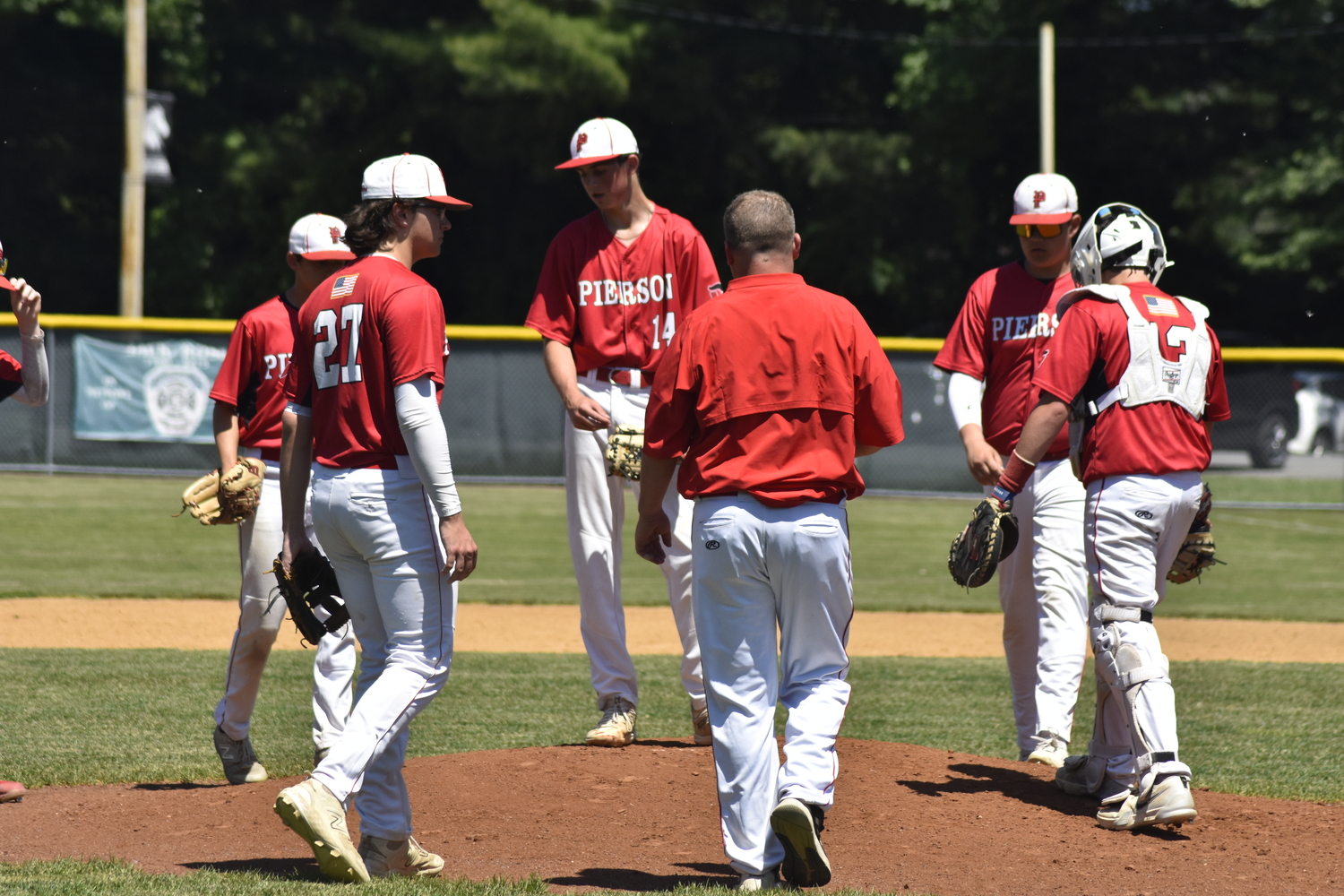 Pierson head coach Bob Manning heads to the mound during Burke Catholic's three-run inning.  DREW BUDD