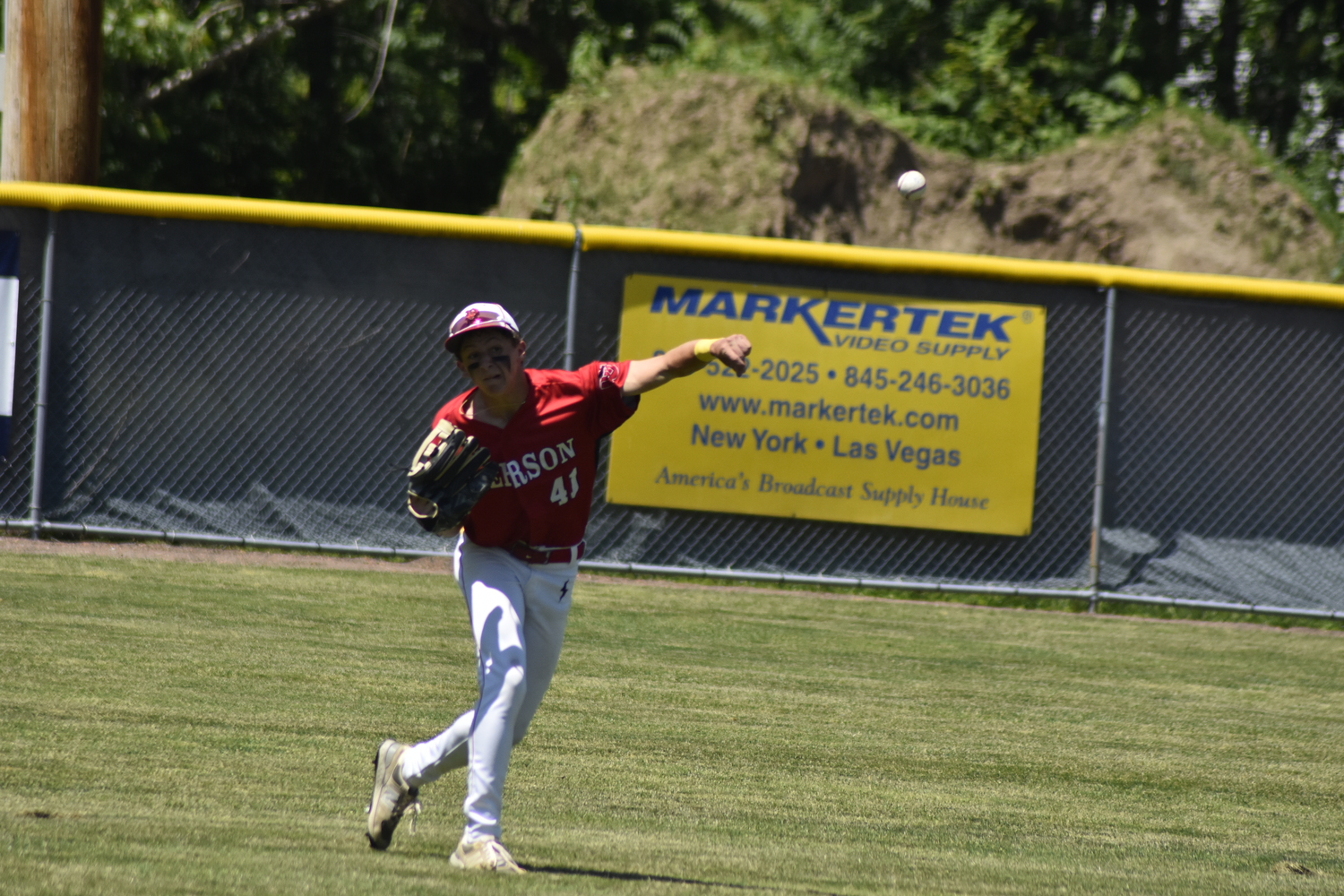 Pierson left fielder Andy Wayne fires the ball back into the infield after catching a fly ball.   DREW BUDD