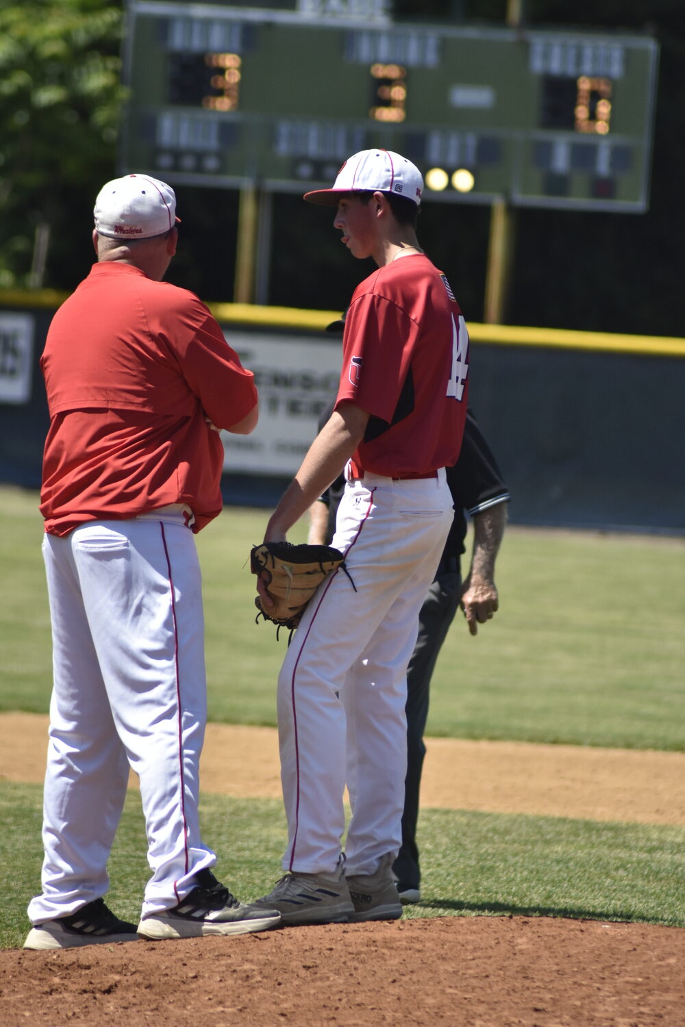 Pierson head coach Bob Manning has another conversation with starting pitcher Braeden Mott.   DREW BUDD