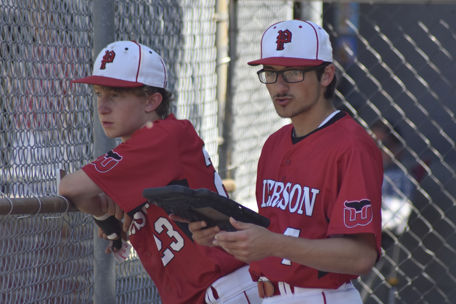 Pierson senior Chad Federico gives head coach Bob Manning some info.  DREW BUDD