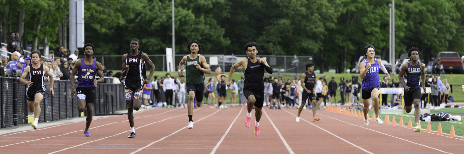 Hampton Bays senior Charlie Garcia won his preliminary heat in the 100-meter dash.   MARIANNE BARNETT