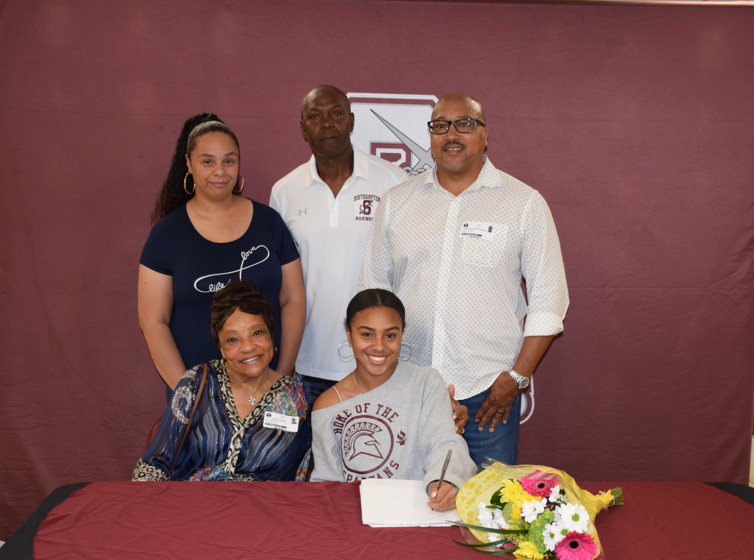 Diamond Brown and family and coach Tony Dottin.   COURTESY SOUTHAMPTON SCHOOL DISTRICT