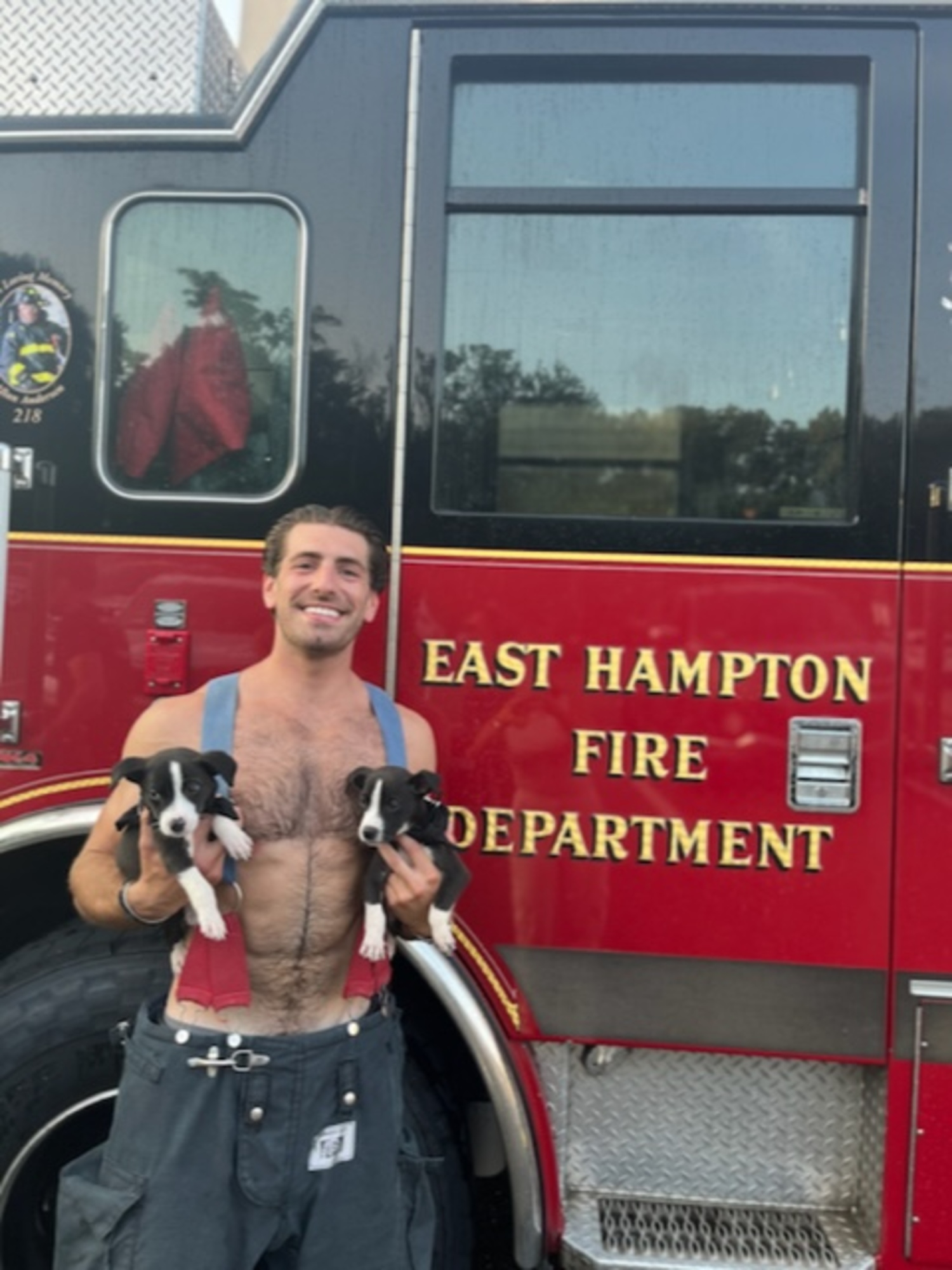 Firefighter Jarrod Silver with adoptable puppies last year.