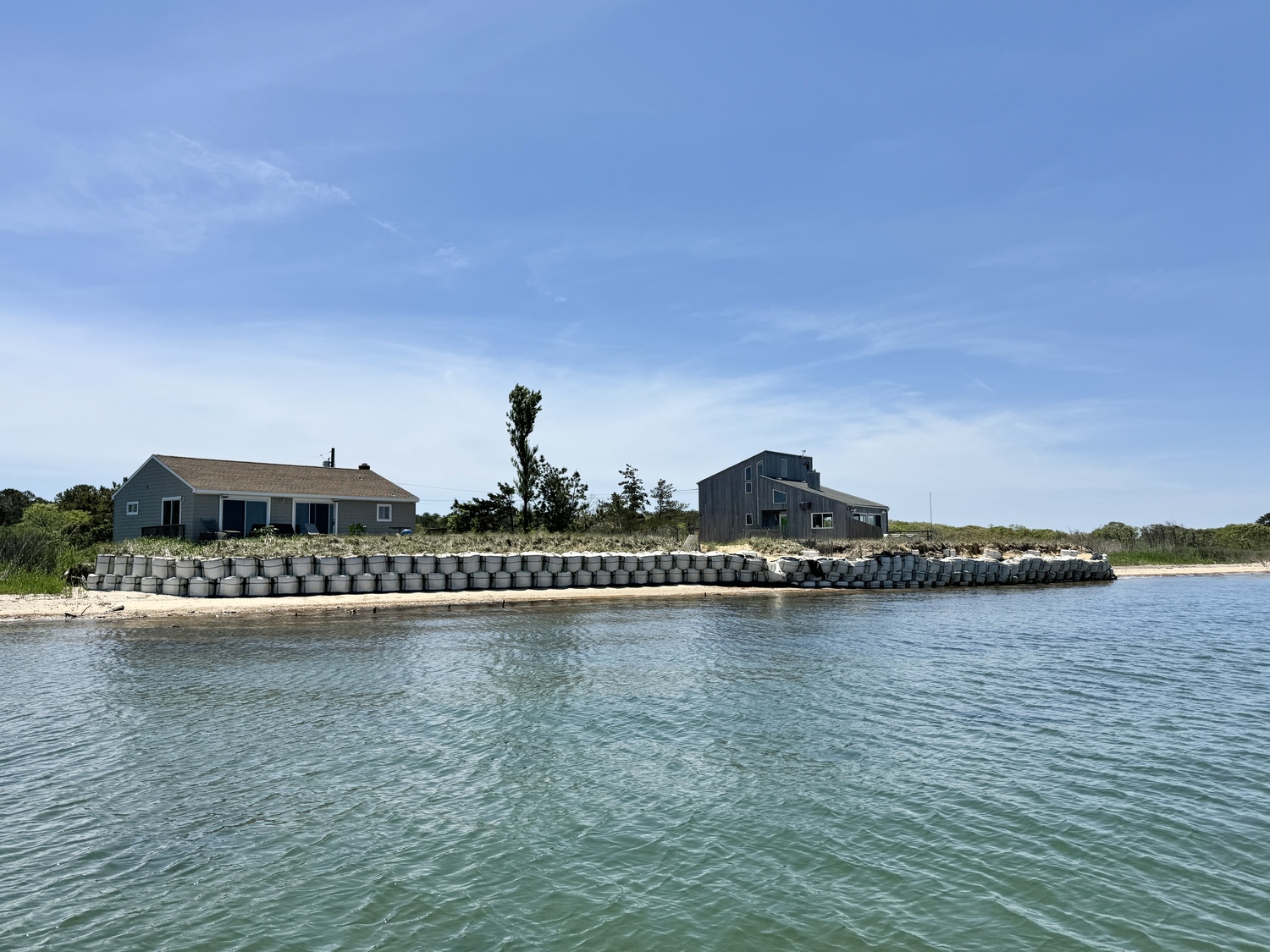 The emergency permit that allowed the sandbags to be put in place in 2018 required that they be covered with sand to protect them from deterioration. But East Hampton Town never allowed the sand to be put in place and the homeowner says that the bags are now deteriorating and starting fail, jeopardizing the home in a storm. MICHAEL WRIGHT