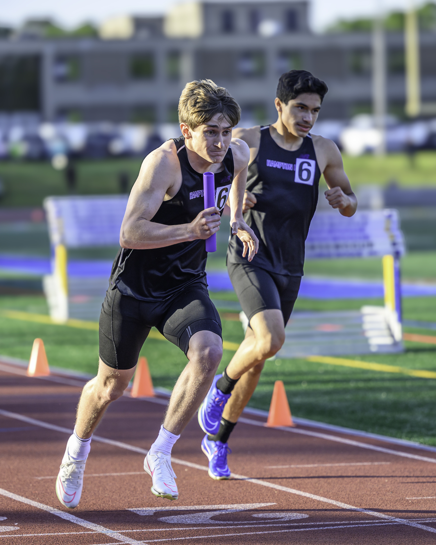 Hampton Bays senior Matthew Papajohn takes off in the 4x400-meter relay after receiving the baton.   MARIANNE BARNETT