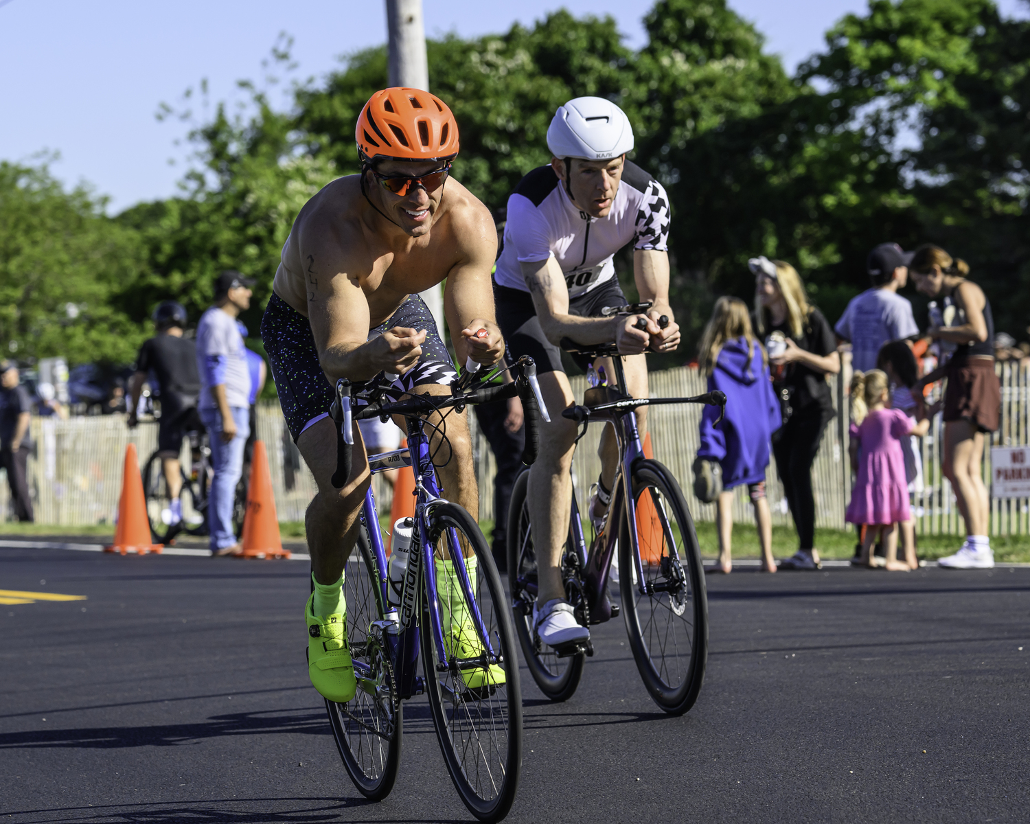 Max Bertz, left, and another triathlete in the bike portion of the race.   MARIANNE BARNETT