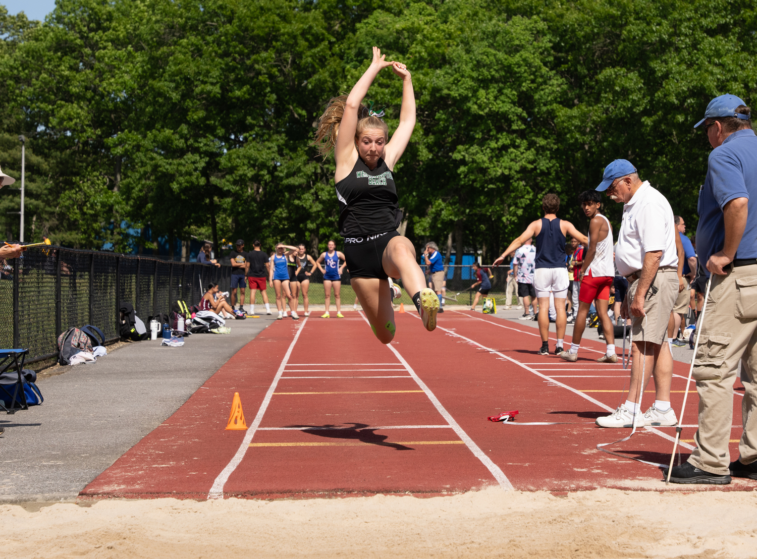 Westhampton Beach senior Madison Phillips competing in the long jump of the pentathlon.   RON ESPOSITO