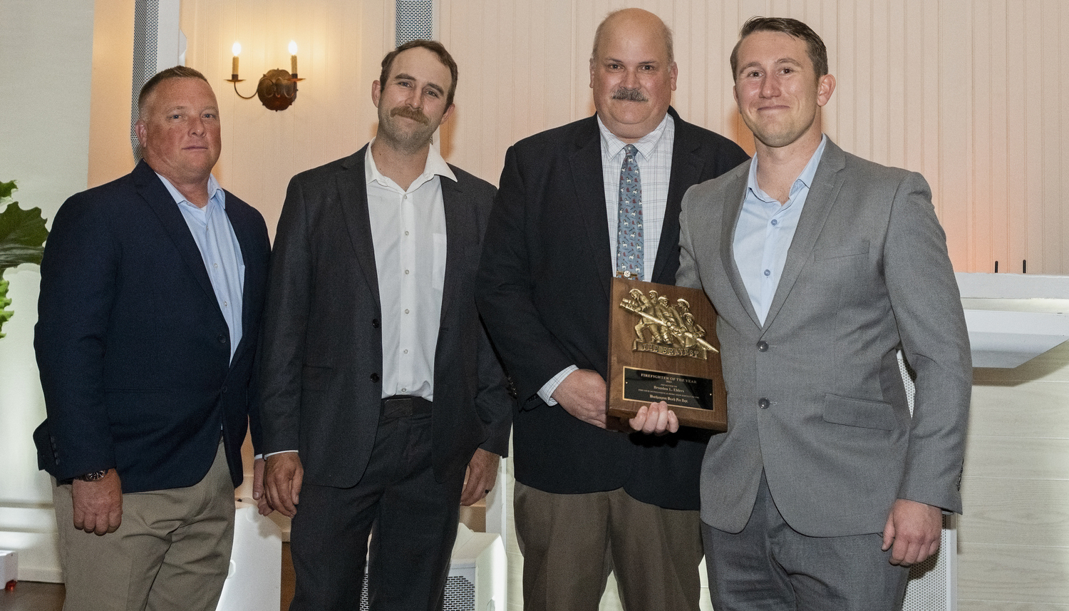 Brandon Ehlers, right, was the recipient of the 2023 Firefighter of the Year Award at the Westhampton Beach Fire Department annual dinner at the Westhampton Country Club on May 31. With him are, from left, Third Assistant Chief Lewis Scott, Second Assistant Chief Jeff Wachenfeld, and Chief Darryl Schunk. COURTESY WESTHAMPTON BEACH FIRE DEPARTMENT