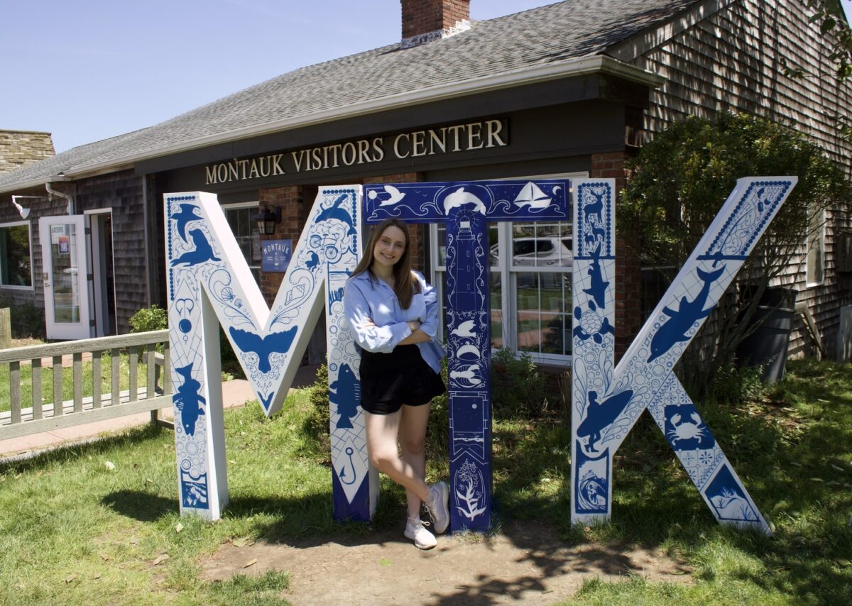 Sarah Schreck with this year's MTK sign design. COURTESY MARIAH MILTIER